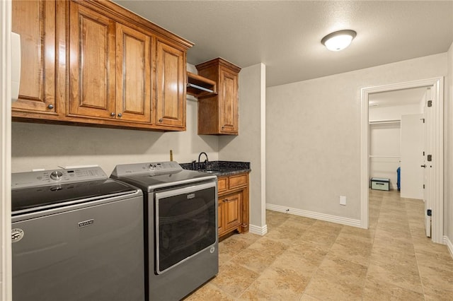 3504 NW Edgewood Ave, Bentonville, AR 72712 - laundry area with separate washer and dryer, cabinet space, and baseboards