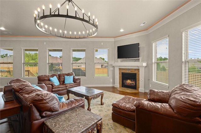 3504 NW Edgewood Ave, Bentonville, AR 72712 - living area featuring wood finished floors, a fireplace, baseboards, ornamental molding, and a chandelier