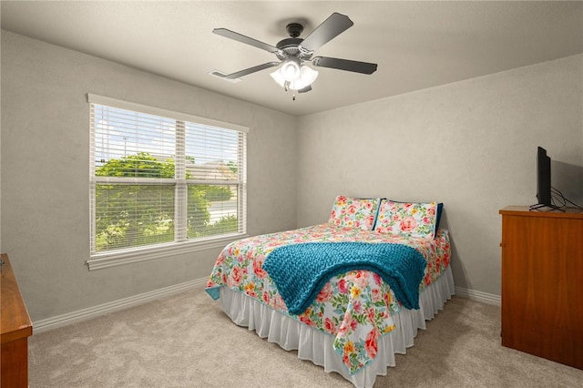 3504 NW Edgewood Ave, Bentonville, AR 72712 - carpeted bedroom with multiple windows, baseboards, and a ceiling fan