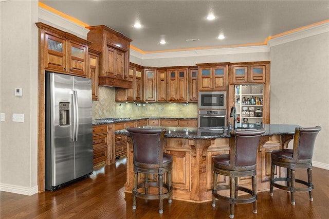 3504 NW Edgewood Ave, Bentonville, AR 72712 - kitchen with appliances with stainless steel finishes, brown cabinetry, baseboards, dark wood finished floors, and crown molding