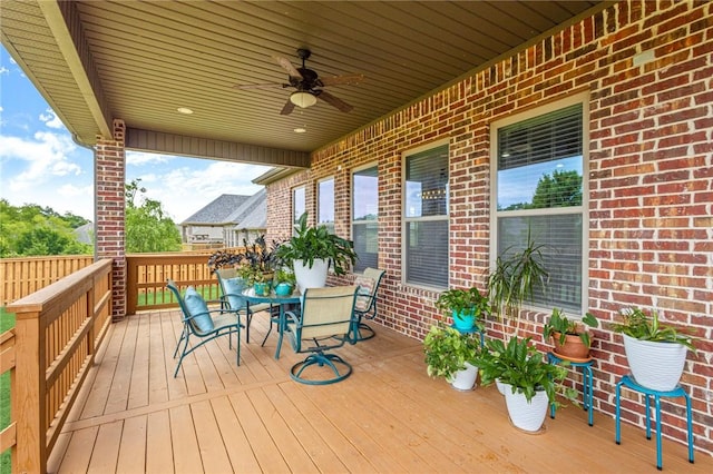 3504 NW Edgewood Ave, Bentonville, AR 72712 - wooden terrace featuring outdoor dining space and a ceiling fan