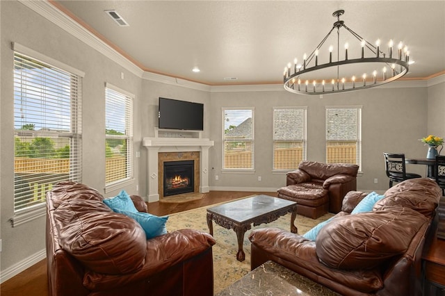 3504 NW Edgewood Ave, Bentonville, AR 72712 - living area featuring baseboards, a chandelier, wood finished floors, a fireplace with flush hearth, and ornamental molding