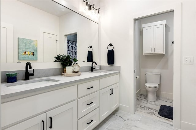 301 SW Autumn Hills Rd, Bentonville, AR 72712 - bathroom featuring marble finish flooring, double vanity, toilet, and baseboards