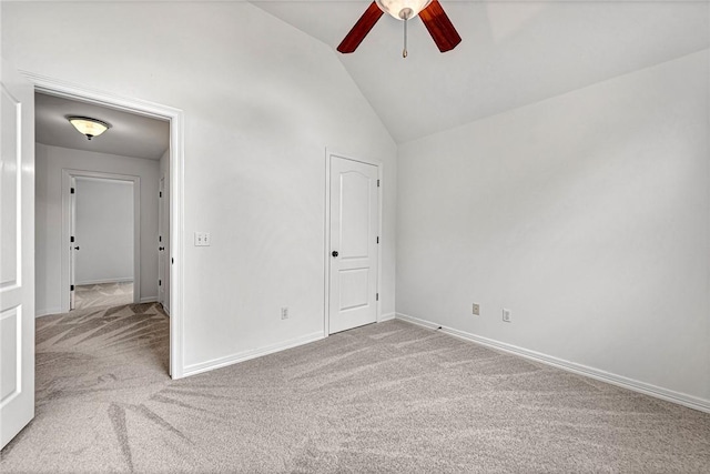 4801 SW Golden Eagle Ave, Bentonville, AR 72713 - carpeted spare room featuring a ceiling fan, vaulted ceiling, and baseboards