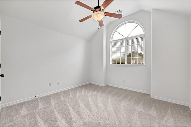 4801 SW Golden Eagle Ave, Bentonville, AR 72713 - empty room with vaulted ceiling, ceiling fan, carpet flooring, and baseboards