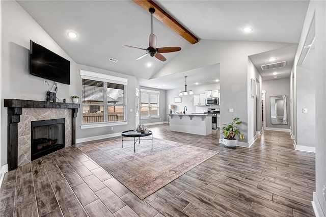 1140 Durante St, Tontitown, AR 72762 - living room with a ceiling fan, dark wood-style floors, baseboards, a fireplace, and recessed lighting