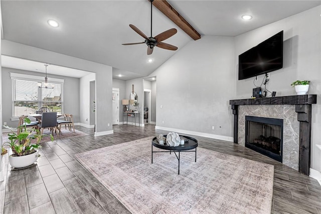1140 Durante St, Tontitown, AR 72762 - living room featuring beam ceiling, ceiling fan, a tile fireplace, baseboards, and wood finished floors