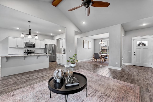 1140 Durante St, Tontitown, AR 72762 - living area with recessed lighting, a ceiling fan, dark wood-style flooring, and baseboards