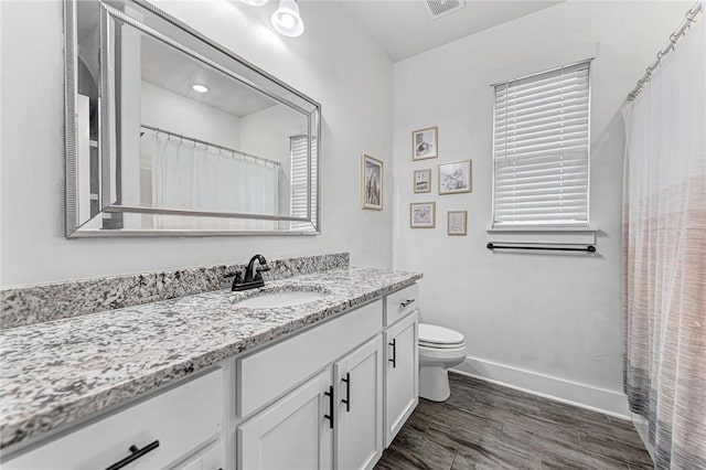 1140 Durante St, Tontitown, AR 72762 - full bath with vanity, toilet, wood finished floors, baseboards, and curtained shower