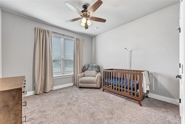 1140 Durante St, Tontitown, AR 72762 - bedroom with carpet, baseboards, a nursery area, and a ceiling fan