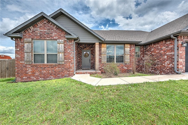 1140 Durante St, Tontitown, AR 72762 - view of front of home featuring brick siding and roof with shingles