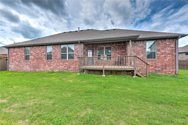 1140 Durante St, Tontitown, AR 72762 - rear view of house with a deck, brick siding, and roof with shingles