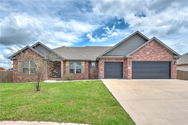 1140 Durante St, Tontitown, AR 72762 - view of front of home with a garage, brick siding, concrete driveway, and roof with shingles