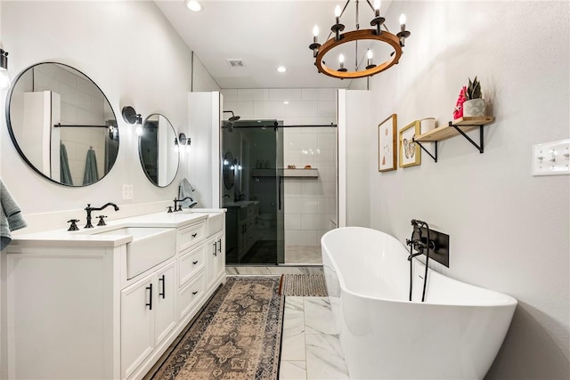112 E Woodside Ln, Rogers, AR 72756 - full bath featuring a shower stall, a freestanding tub, double vanity, a chandelier, and recessed lighting