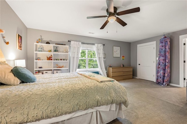 112 E Woodside Ln, Rogers, AR 72756 - bedroom with carpet, baseboards, and a ceiling fan