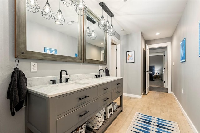 112 E Woodside Ln, Rogers, AR 72756 - full bath featuring double vanity, wood finished floors, and baseboards
