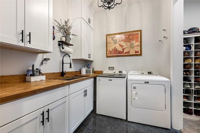 112 E Woodside Ln, Rogers, AR 72756 - washroom featuring cabinet space and independent washer and dryer