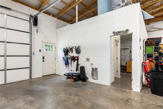 112 E Woodside Ln, Rogers, AR 72756 - garage featuring a wall mounted air conditioner