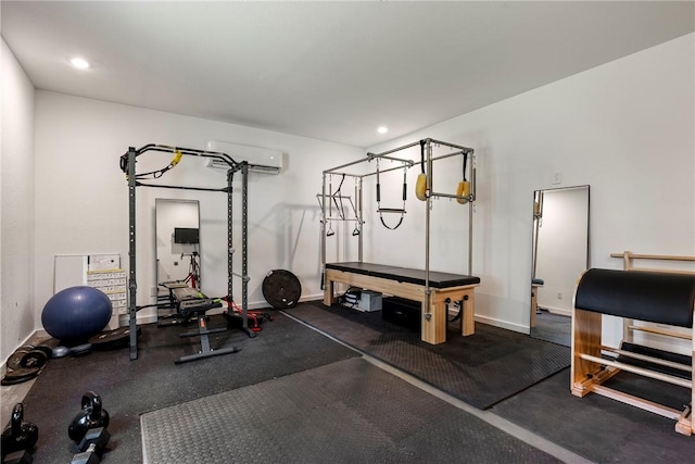 112 E Woodside Ln, Rogers, AR 72756 - workout area featuring an AC wall unit, baseboards, and recessed lighting