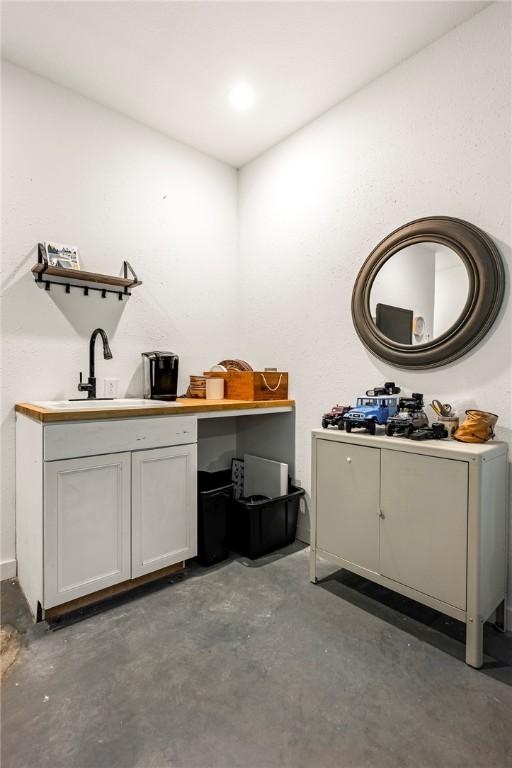 112 E Woodside Ln, Rogers, AR 72756 - misc room featuring unfinished concrete floors and a sink