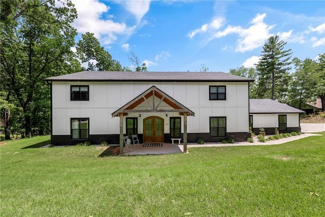 112 E Woodside Ln, Rogers, AR 72756 - view of front of home featuring french doors, a front yard, and roof with shingles