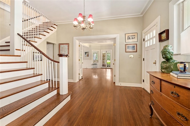 615 E Prairie Creek Dr, Rogers, AR 72756 - entryway featuring wood finished floors, stairs, ornamental molding, a chandelier, and baseboards