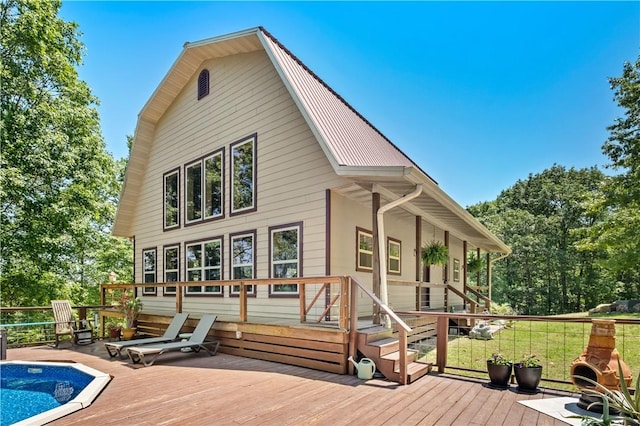 482 County Road 332, Eureka Springs, AR 72632 - back of property with a deck and metal roof