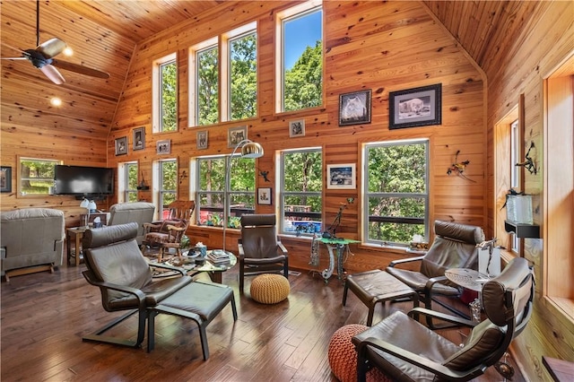 482 County Road 332, Eureka Springs, AR 72632 - living area featuring high vaulted ceiling, wood walls, wood ceiling, a ceiling fan, and hardwood / wood-style floors