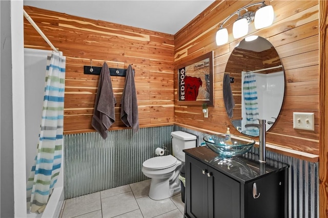 482 County Road 332, Eureka Springs, AR 72632 - full bathroom with tile patterned floors, vanity, toilet, wood walls, and shower / tub combo with curtain