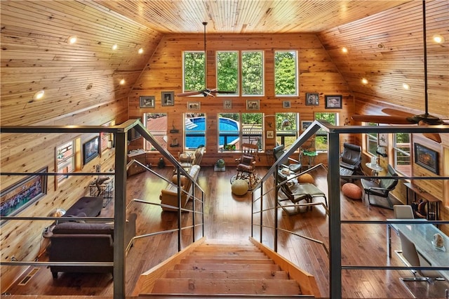 482 County Road 332, Eureka Springs, AR 72632 - stairway with wooden walls, high vaulted ceiling, hardwood / wood-style floors, wooden ceiling, and ceiling fan