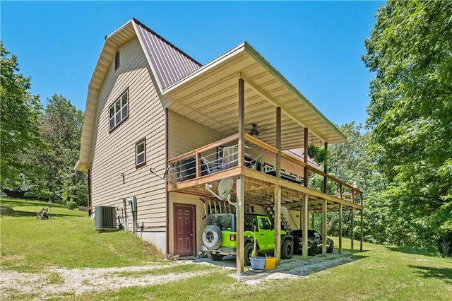 482 County Road 332, Eureka Springs, AR 72632 - back of house featuring a yard, ceiling fan, central AC unit, and a deck