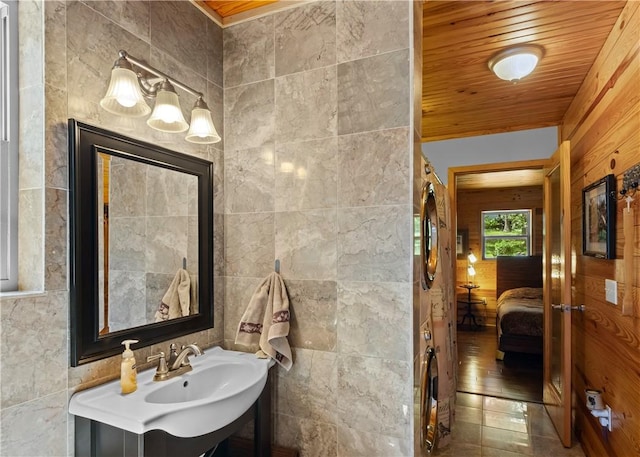 482 County Road 332, Eureka Springs, AR 72632 - bathroom with tile walls, ensuite bath, vanity, and wooden ceiling