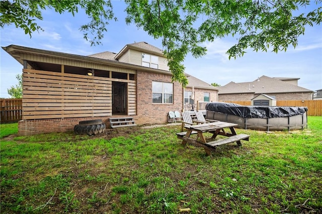 1320 Lariat Dr, Centerton, AR 72719 - rear view of house with brick siding