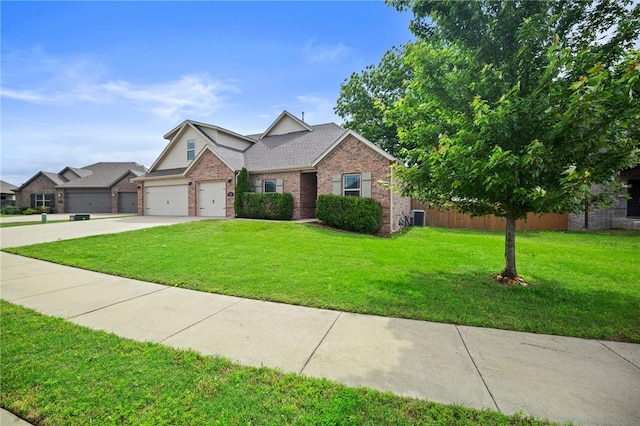 1320 Lariat Dr, Centerton, AR 72719 - view of front of property with brick siding, a front yard, central air condition unit, concrete driveway, and an attached garage
