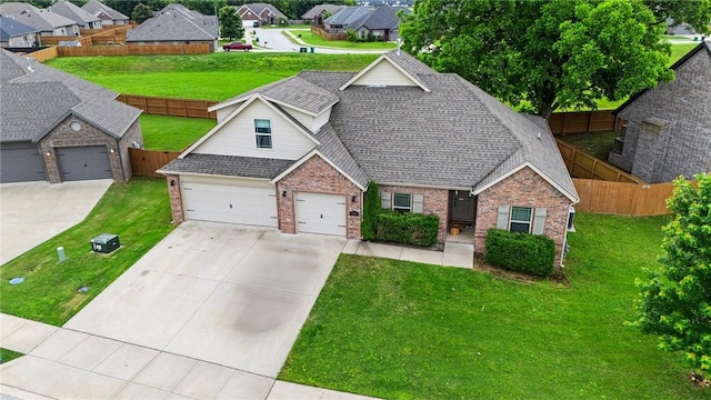 1320 Lariat Dr, Centerton, AR 72719 - view of front of house with brick siding, concrete driveway, a residential view, and a shingled roof