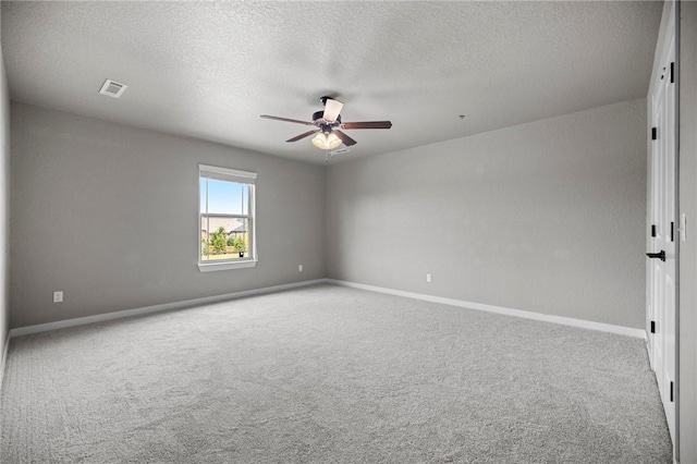 1320 Lariat Dr, Centerton, AR 72719 - carpeted empty room with ceiling fan, a textured ceiling, and baseboards