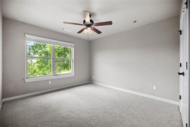 1320 Lariat Dr, Centerton, AR 72719 - carpeted spare room with baseboards and ceiling fan