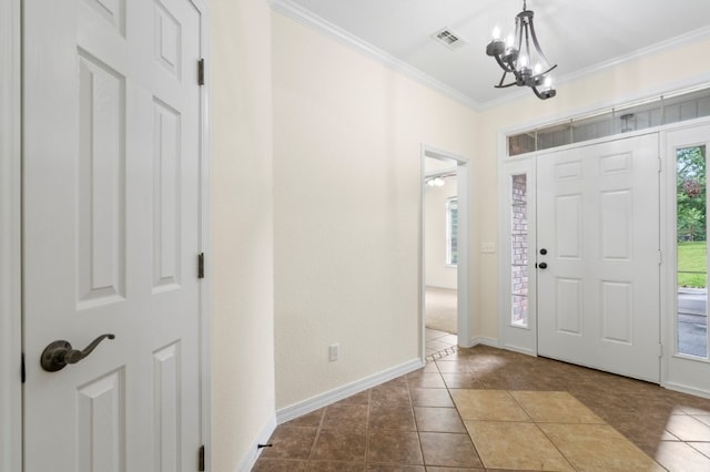 12305 Tyson Rd, Lowell, AR 72745 - foyer entrance featuring healthy amount of natural light, ornamental molding, a chandelier, and tile patterned flooring