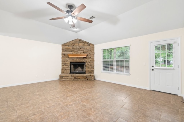 12305 Tyson Rd, Lowell, AR 72745 - unfurnished living room featuring plenty of natural light, a ceiling fan, a stone fireplace, and lofted ceiling