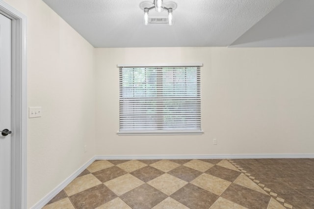 12305 Tyson Rd, Lowell, AR 72745 - spare room featuring a textured ceiling