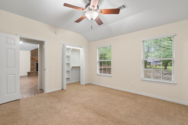 12305 Tyson Rd, Lowell, AR 72745 - unfurnished bedroom with carpet flooring, vaulted ceiling, and a ceiling fan