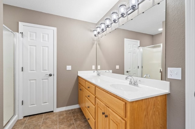 12305 Tyson Rd, Lowell, AR 72745 - full bathroom with a shower stall, double vanity, tile patterned floors, and a textured wall