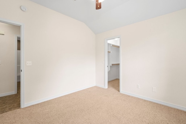 12305 Tyson Rd, Lowell, AR 72745 - unfurnished bedroom with carpet floors, lofted ceiling, a spacious closet, a closet, and ceiling fan