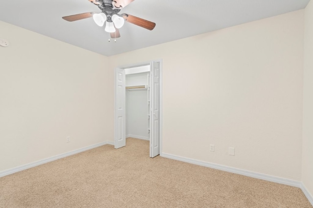 12305 Tyson Rd, Lowell, AR 72745 - unfurnished bedroom with light carpet and a ceiling fan