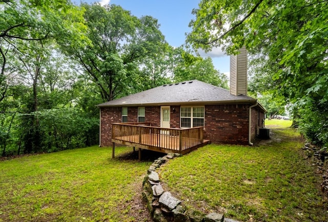 12305 Tyson Rd, Lowell, AR 72745 - rear view of property featuring a chimney, a deck, a yard, and brick siding