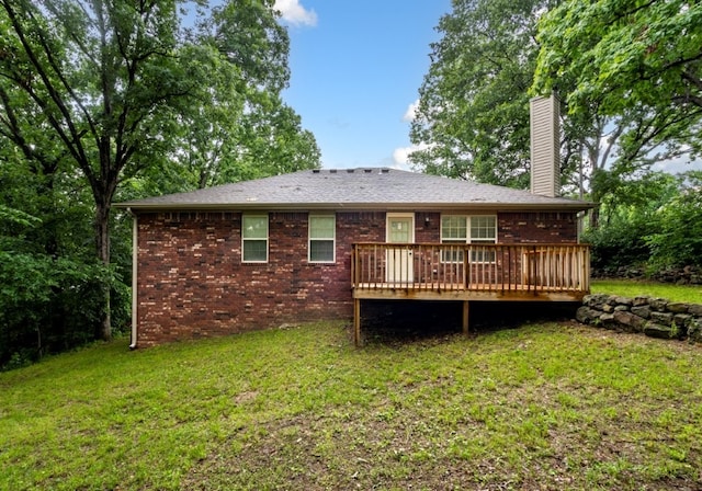 12305 Tyson Rd, Lowell, AR 72745 - rear view of property with a chimney, a deck, a yard, and brick siding