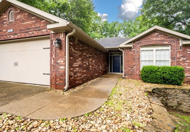 12305 Tyson Rd, Lowell, AR 72745 - ranch-style house featuring an attached garage and brick siding