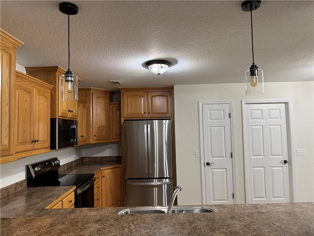 12305 Tyson Rd, Lowell, AR 72745 - kitchen featuring black appliances, dark countertops, a textured ceiling, pendant lighting, and brown cabinetry