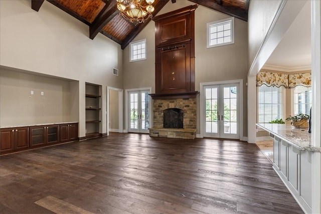 4465 Champagne Dr, Springdale, AR 72764 - unfurnished living room featuring high vaulted ceiling, french doors, healthy amount of natural light, dark wood-style floors, and wooden ceiling with exposed beams