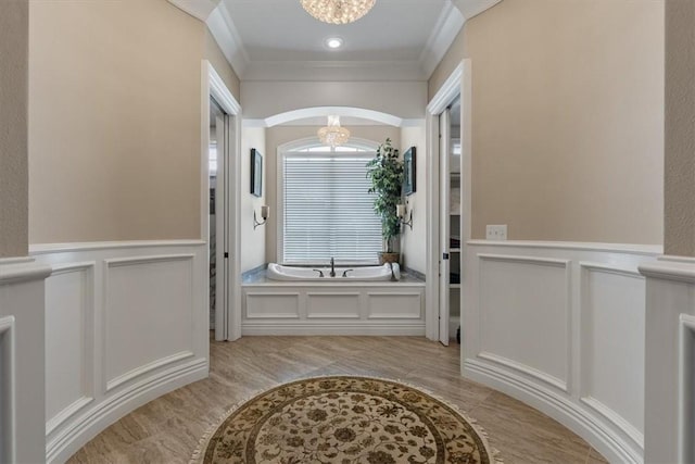 4465 Champagne Dr, Springdale, AR 72764 - bathroom with a decorative wall, a chandelier, ornamental molding, a garden tub, and a wainscoted wall